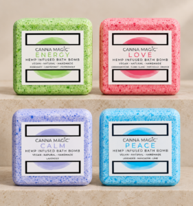 Four Canna Magic bath bombs with labels in a two-by-two arrangement